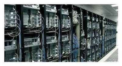 A bustling mining farm filled with rows of ASIC miners, showcasing the scale and infrastructure required for efficient cryptocurrency mining operations.