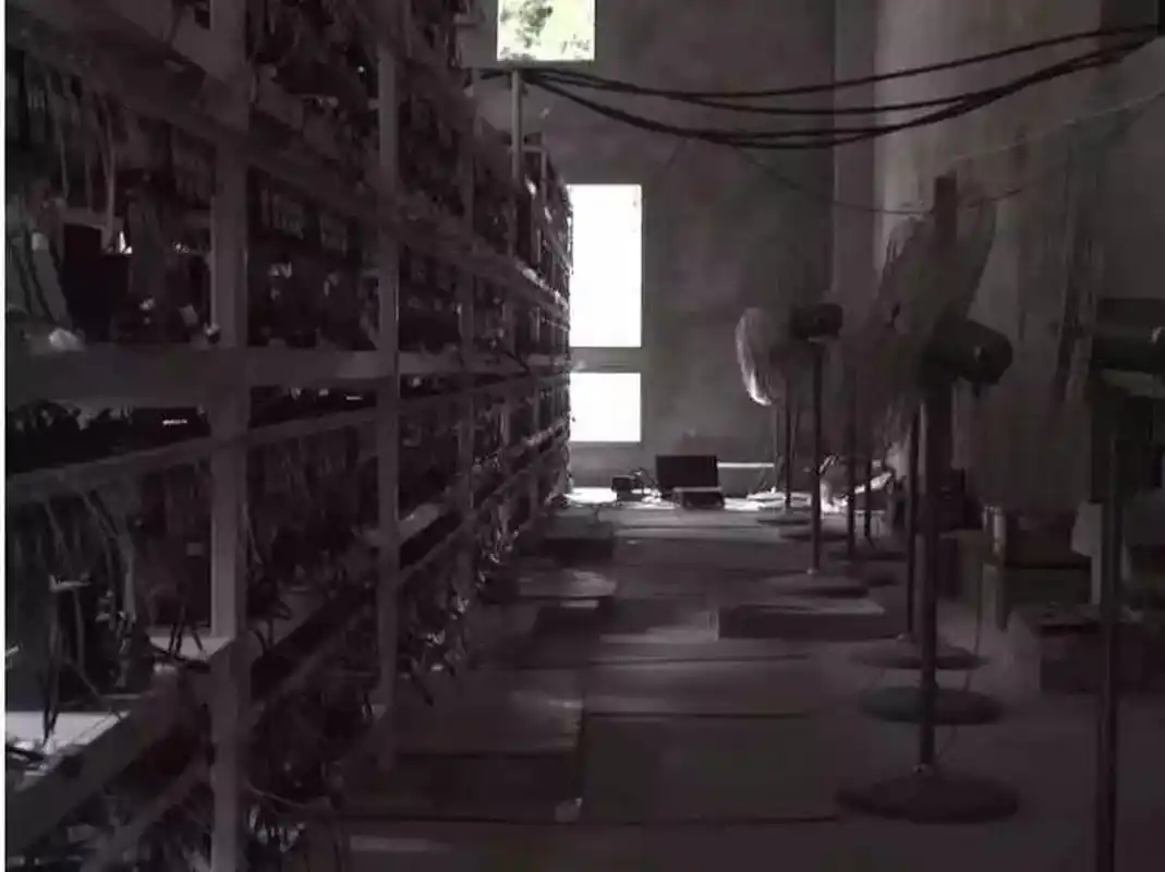 A vast mining farm showcasing rows upon rows of mining rigs.
